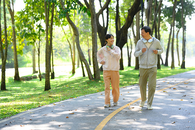 A man brisk walking one year after his hip replacement surgery