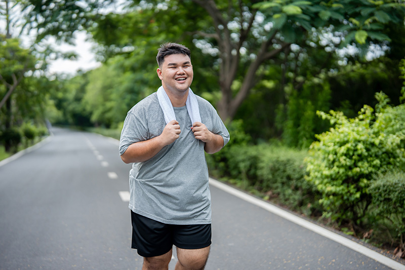 A man going for a jog after his knee replacement surgery